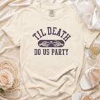Cream t-shirt with "Til Death Do Us Party" text and skeleton hands.