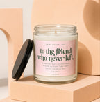 Glass candle with pink label that says "to the friend who never left."