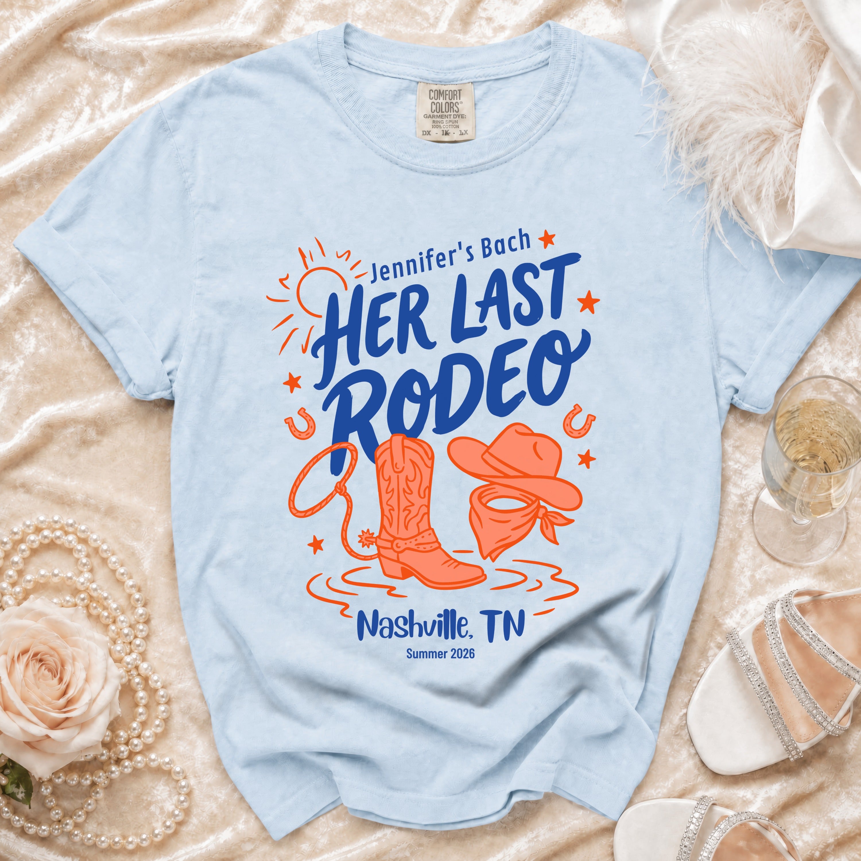 Blue t-shirt with "Jennifer's Bach Her Last Rodeo Nashville, TN Summer 2026" and rodeo graphics.