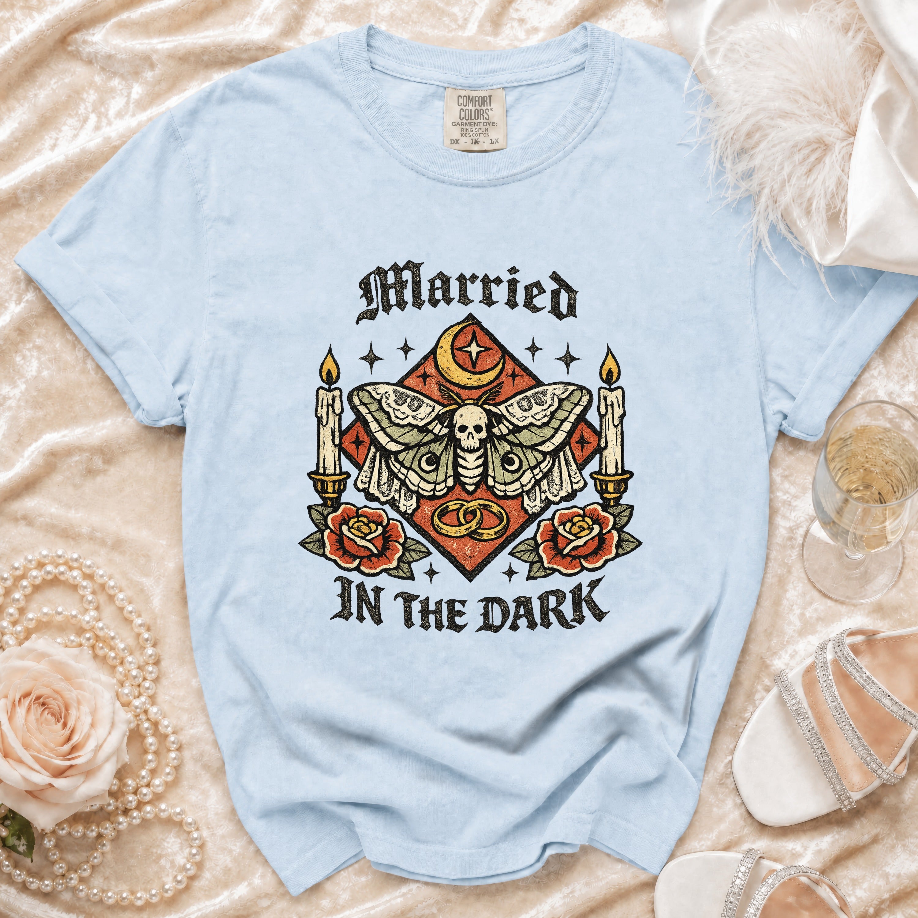 Light blue t-shirt with "Married In The Dark" graphic featuring a moth and skull.
