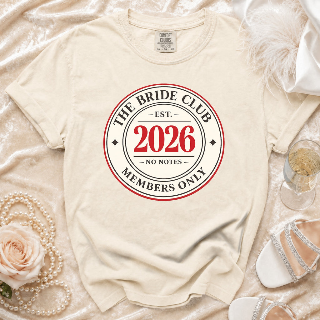 Cream t-shirt with "The Bride Club Est. 2026 Members Only" logo.