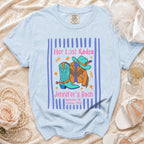 Light blue t-shirt with "Her Last Rodeo Jennifer's Bach" and cowboy boot graphic.