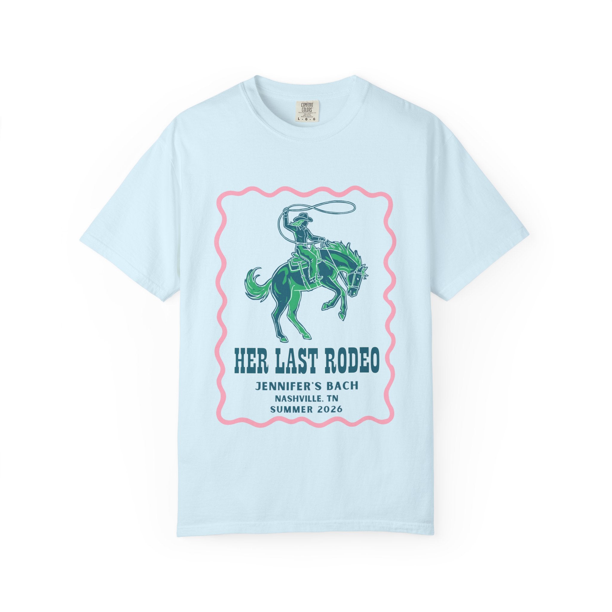 Light blue t-shirt with a pink border and a graphic of a rodeo rider.