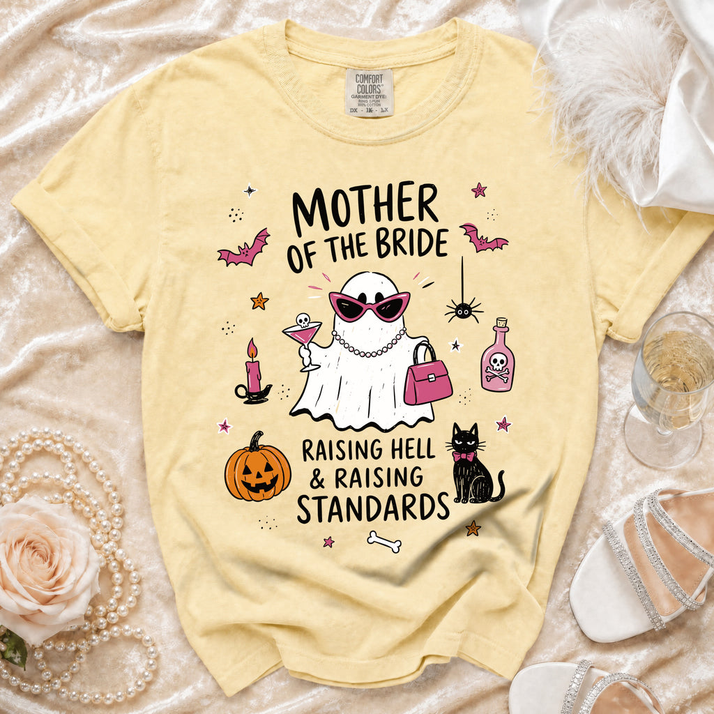 Yellow t-shirt with "Mother of the Bride Raising Hell & Raising Standards" and ghost graphic.