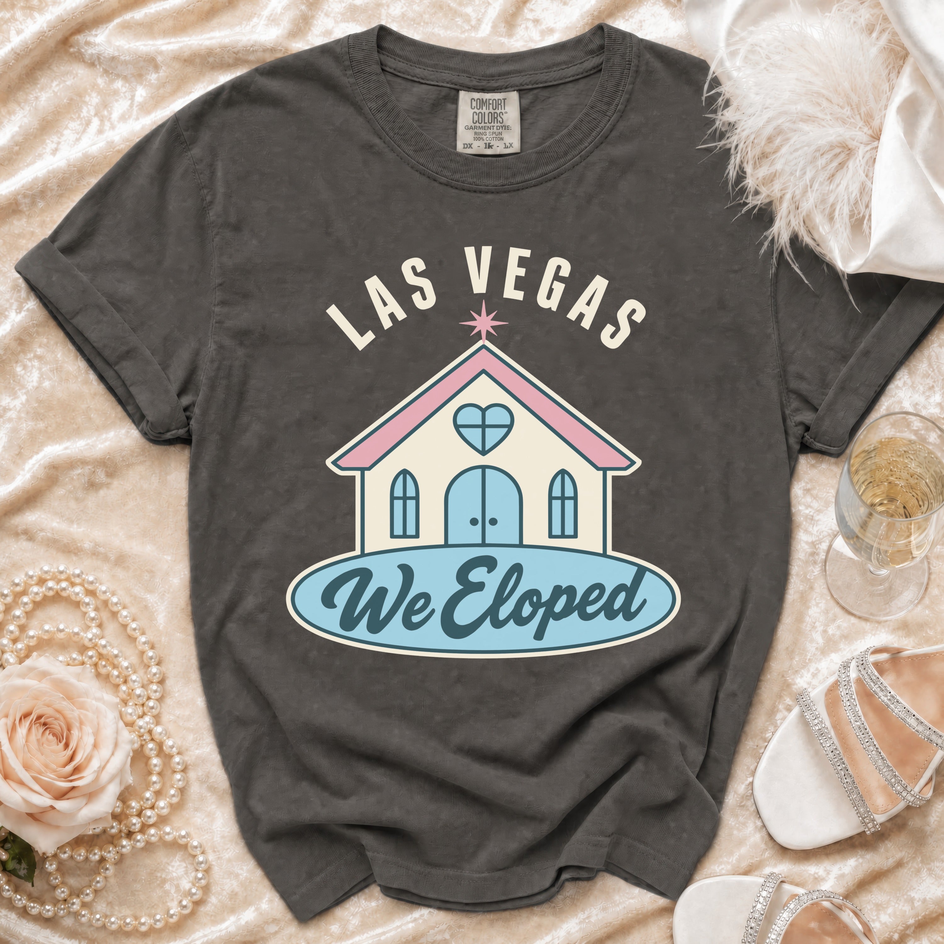 Dark grey t-shirt with "LAS VEGAS We Eloped" and wedding chapel graphic.