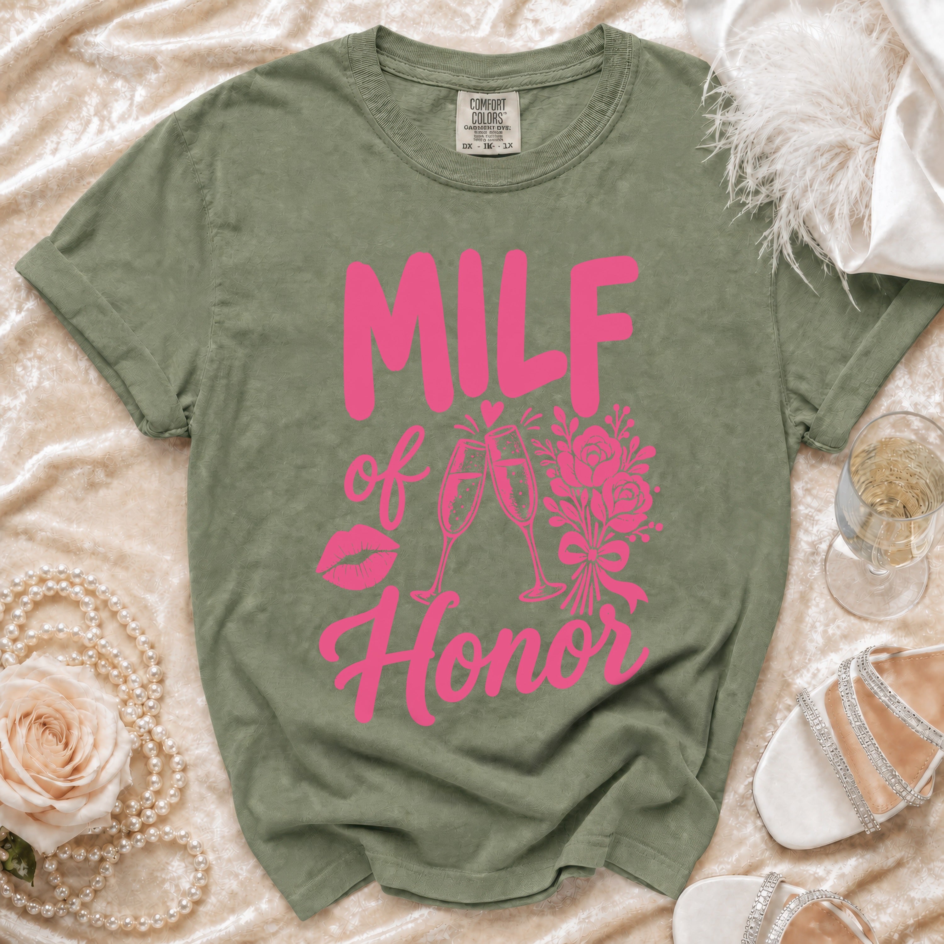 Green t-shirt with pink "MILF of Honor" text, lips, champagne glasses, and flowers.