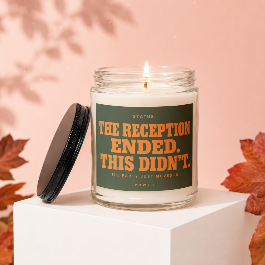 Candle with text "The Reception Ended. This Didn't." on a dark green label.