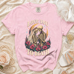 Pink t-shirt with skeleton couple graphic and "Love You To Death" text.