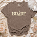 Brown t-shirt with "BRIDE" text and a stylized middle finger graphic.
