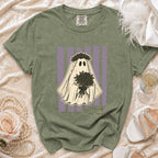 Olive green t-shirt with a ghost design wearing a flower crown and holding flowers, with text "haunting the aisle".