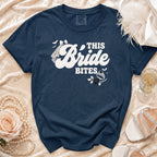 Dark navy t-shirt with "This Bride Bites" text and gothic bride graphics.
