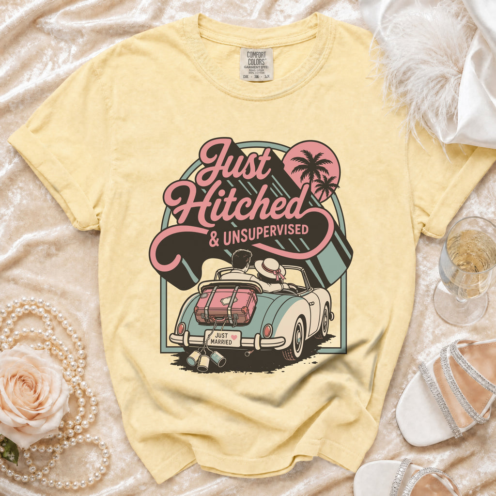 Yellow t-shirt with "Just Hitched & Unsupervised" graphic on convertible car.