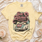 Yellow t-shirt with "Just Hitched & Unsupervised" graphic on convertible car.