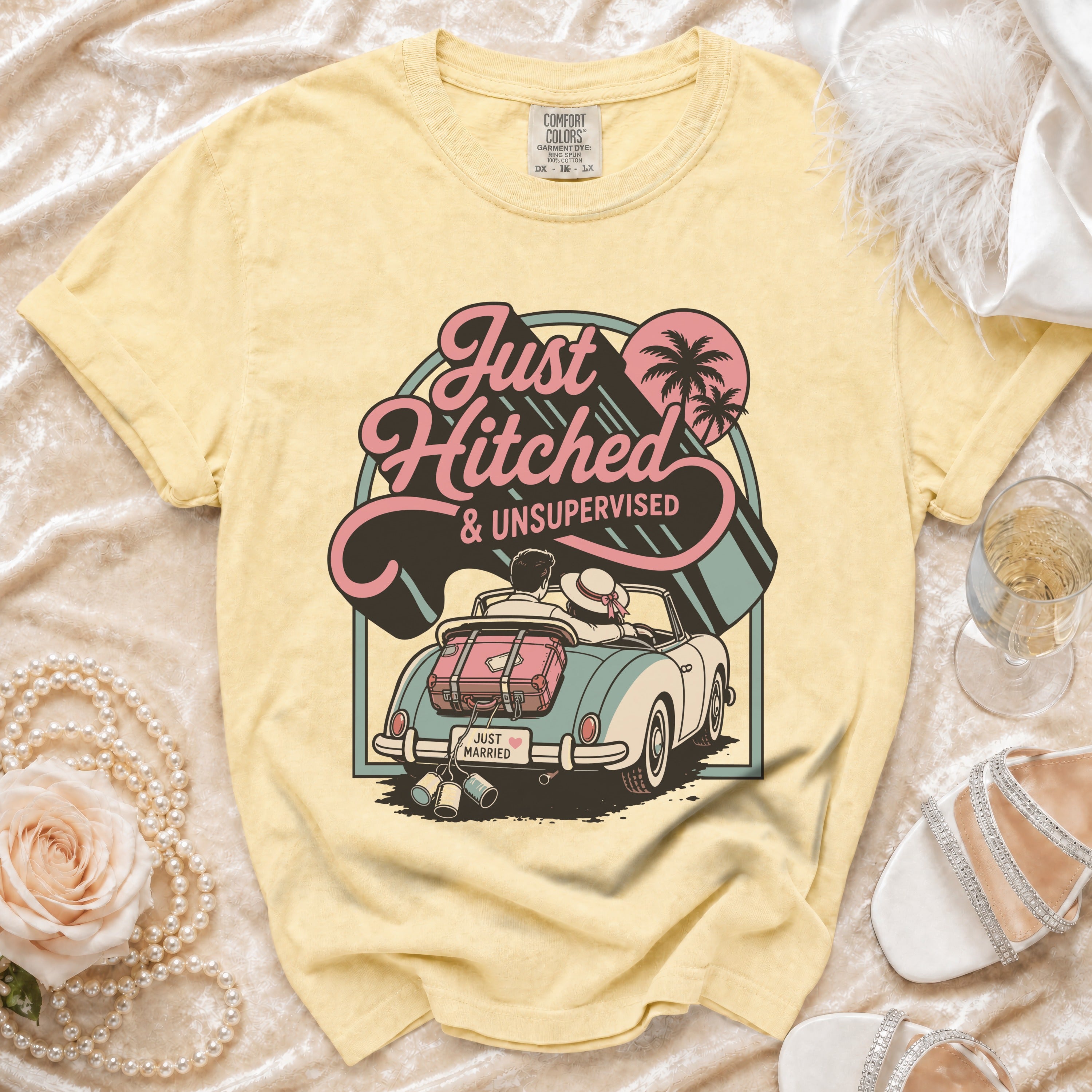 Yellow t-shirt with "Just Hitched & Unsupervised" graphic on convertible car.