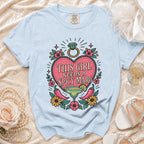 Light blue t-shirt with "This Girl Needs a Spicy Marg" graphic and ring.