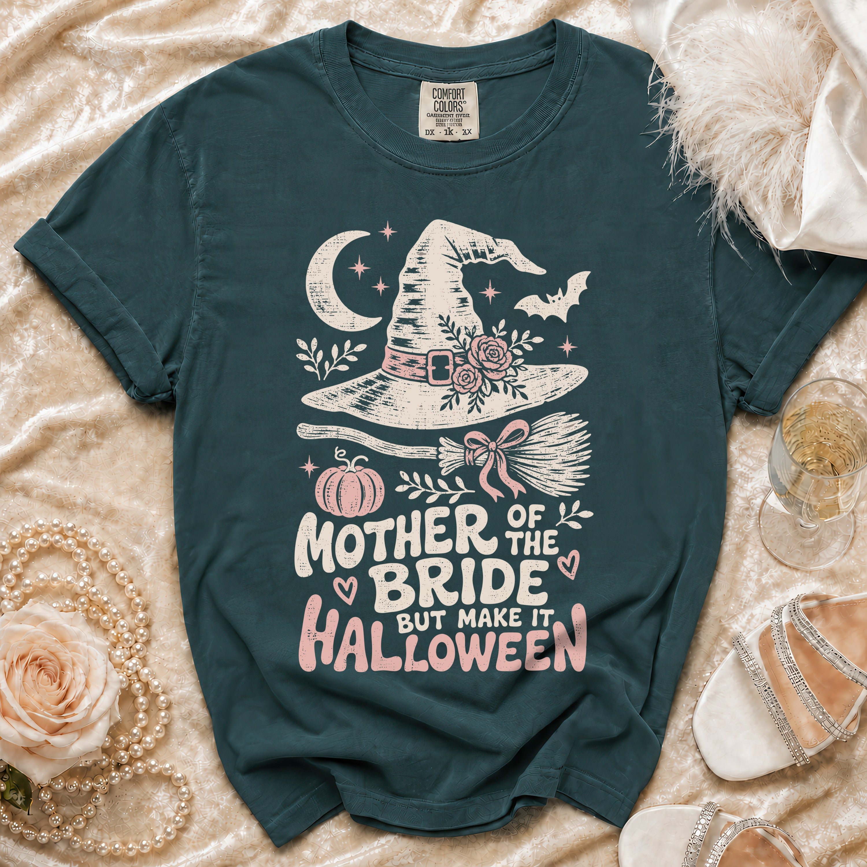 Dark teal t-shirt with "Mother of the Bride but make it Halloween" graphic.