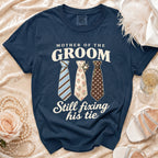 Navy t-shirt with "Mother of the Groom Still Fixing His Tie" text and three ties.
