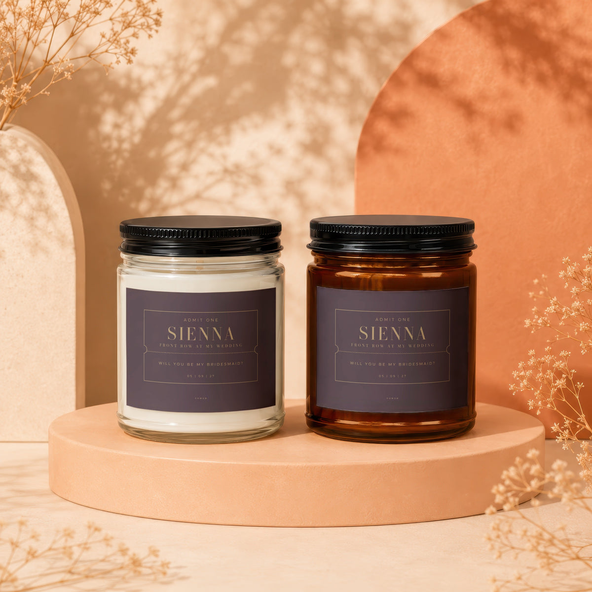 Two candles with labels asking "Will you be my bridesmaid?" for "Sienna".