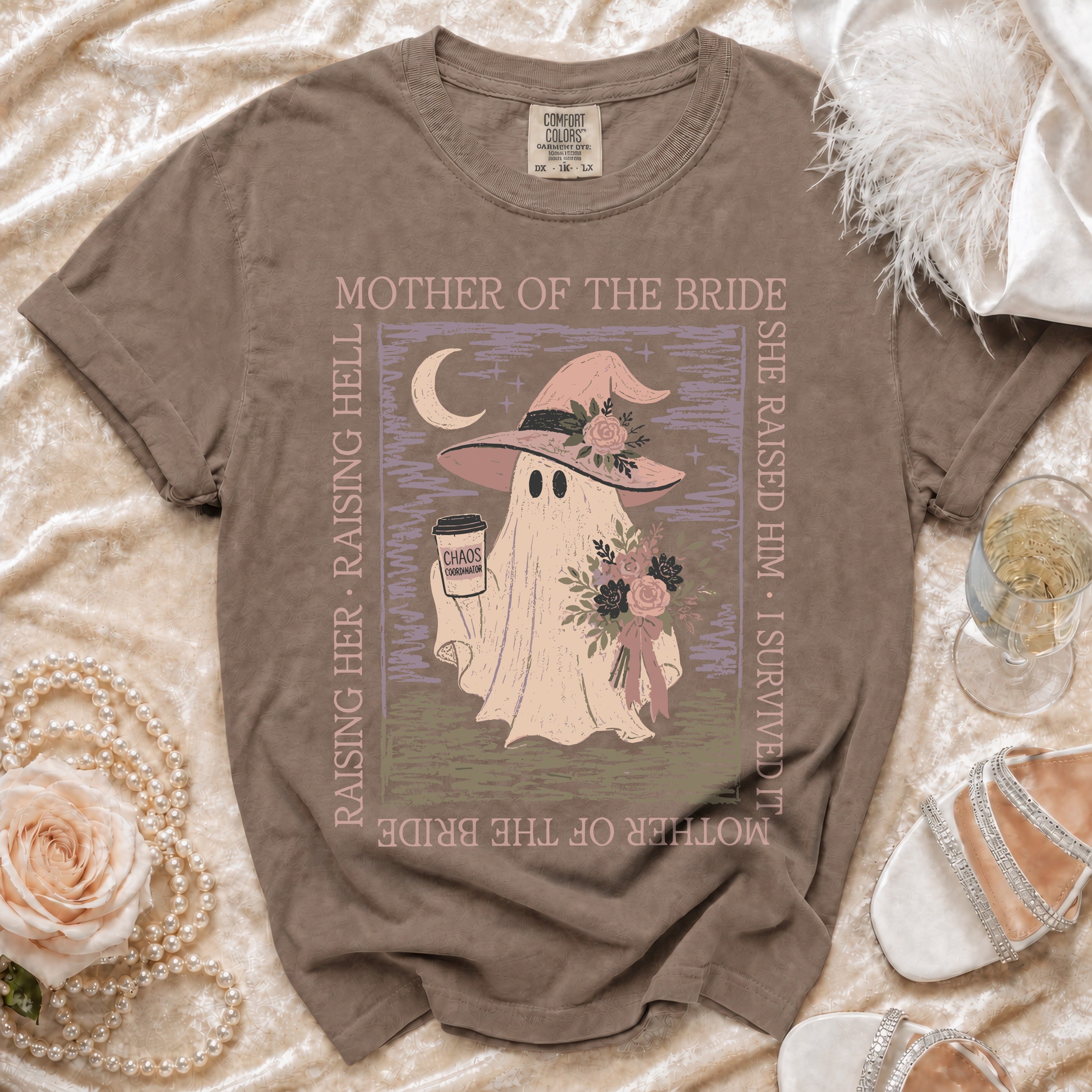 Brown shirt with ghost wearing witch hat and holding coffee, saying "Mother of the Bride".