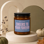 Candle with text "Cheers to your forever. I'll be sitting down for mine. Vowed."