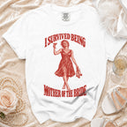 White t-shirt with "I Survived Being Mother of the Bride" graphic.