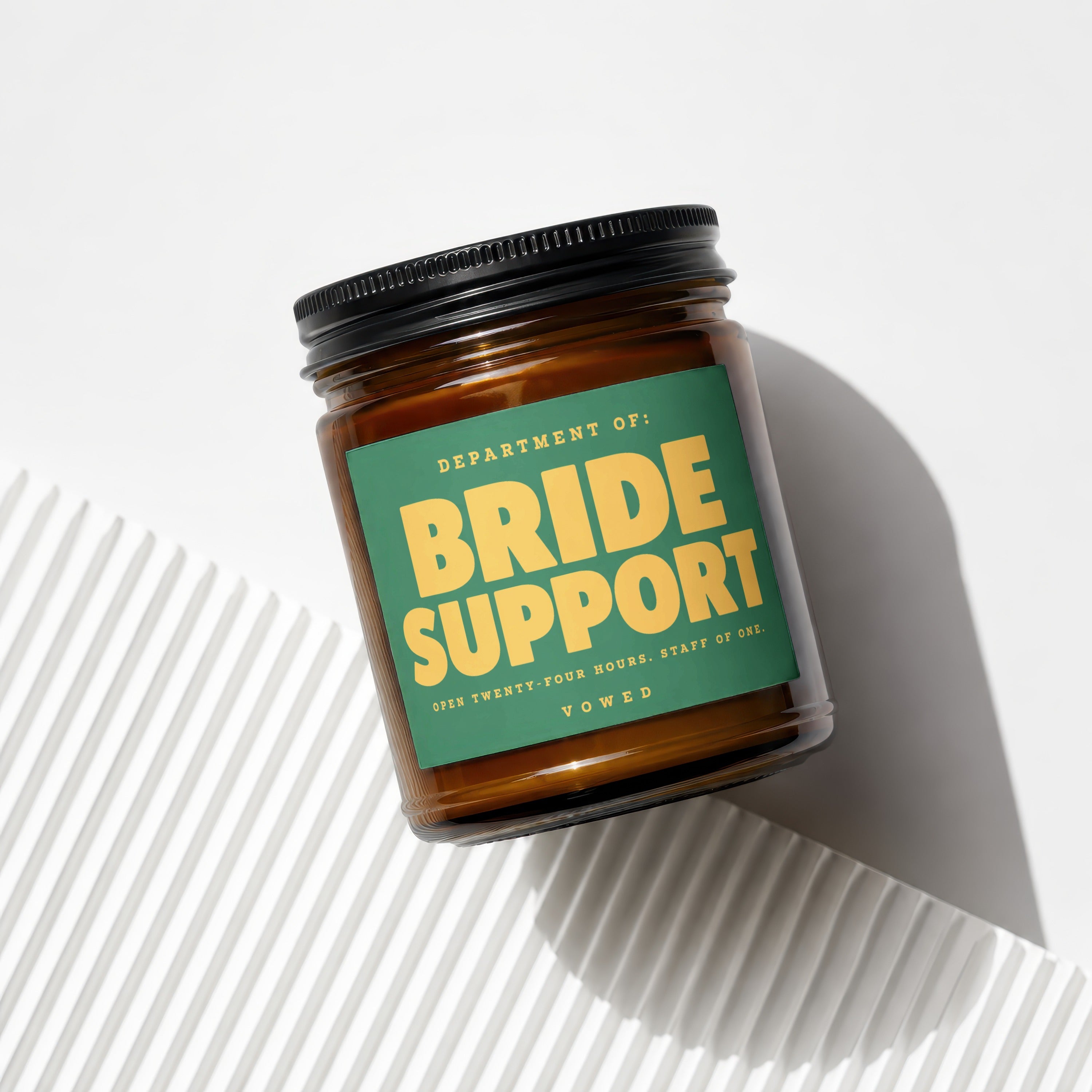 Amber jar candle labeled "Department of: Bride Support" with accompanying text.