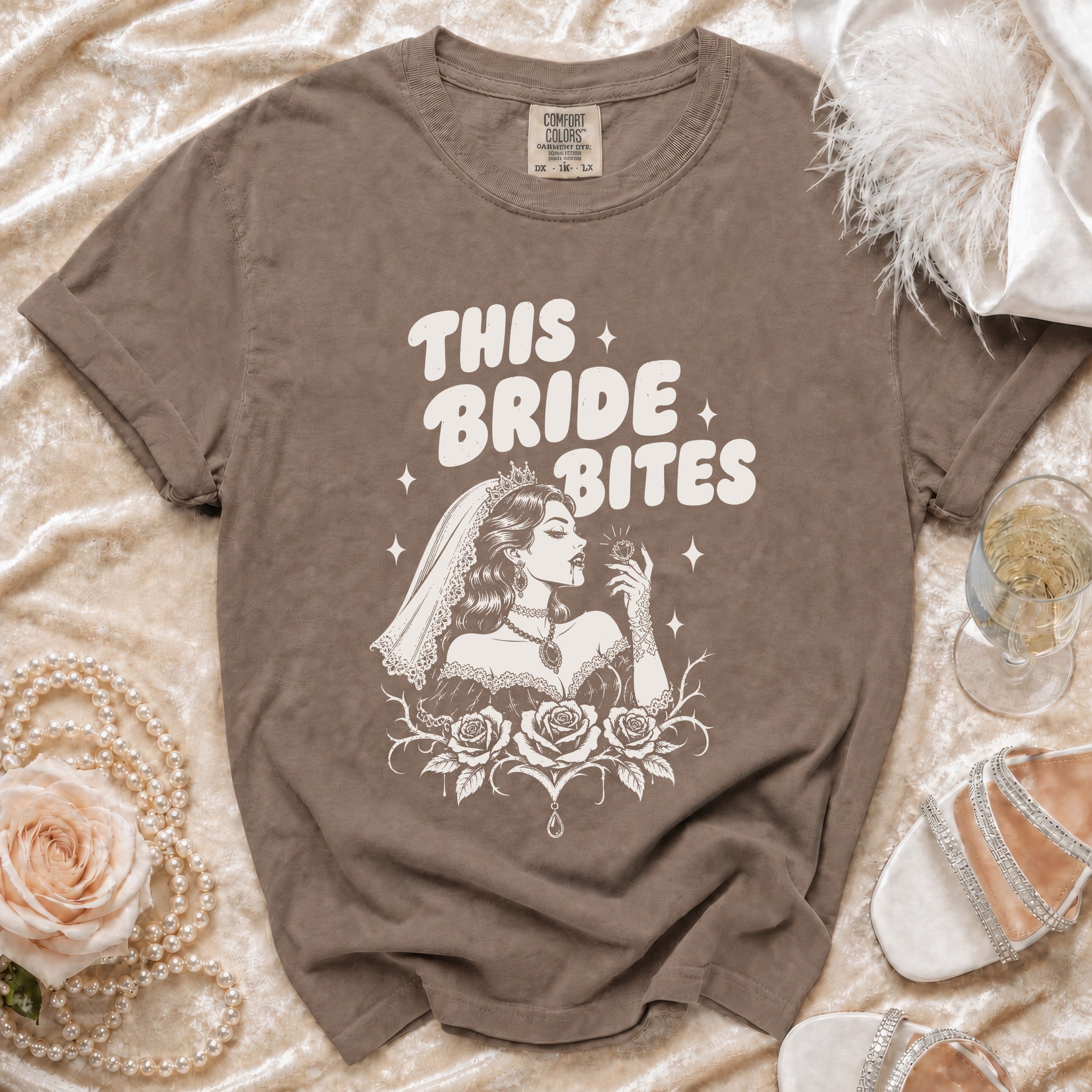 Brown t-shirt with "This Bride Bites" text and a vampire bride graphic.