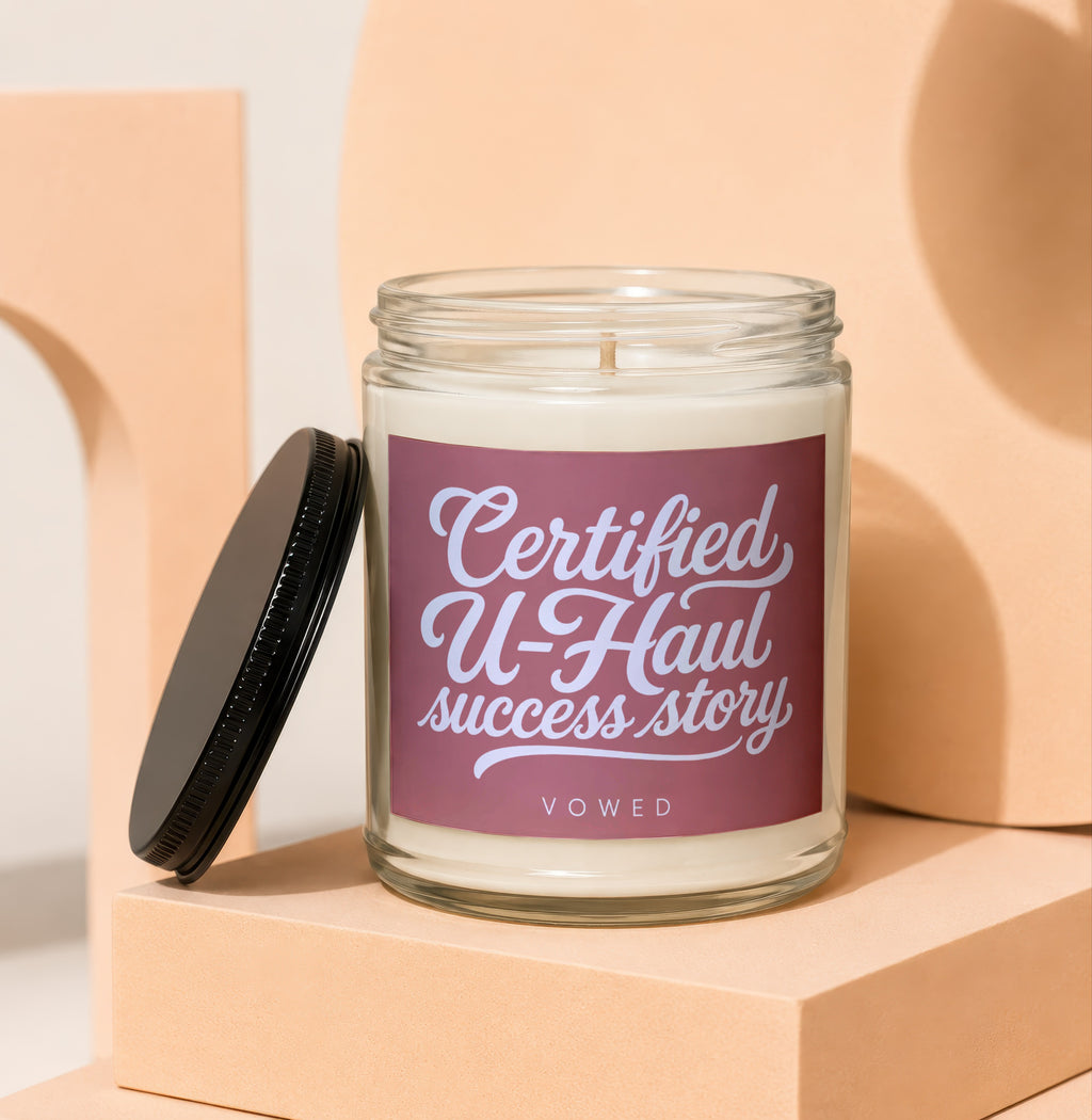 Candle with text "Certified U-Haul success story VOWED".