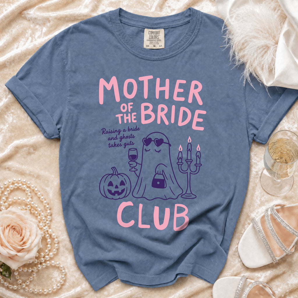 Blue t-shirt with "Mother of the Bride Club" text and ghost graphic.