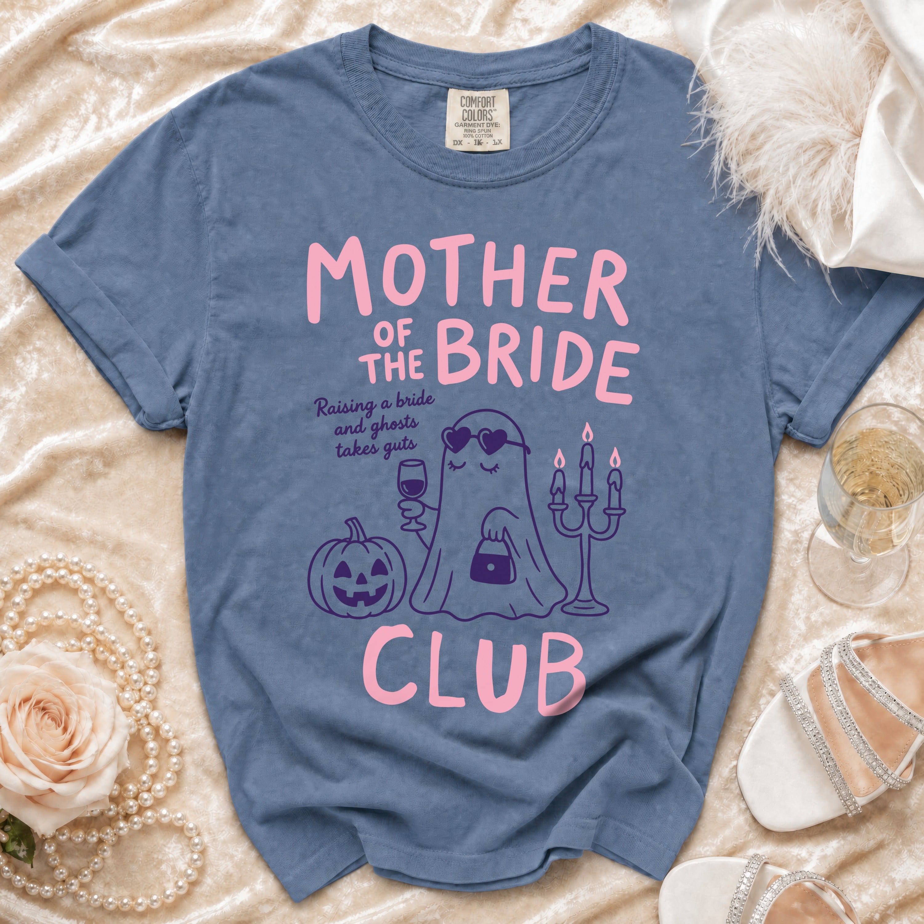Blue t-shirt with "Mother of the Bride Club" text and ghost graphic.