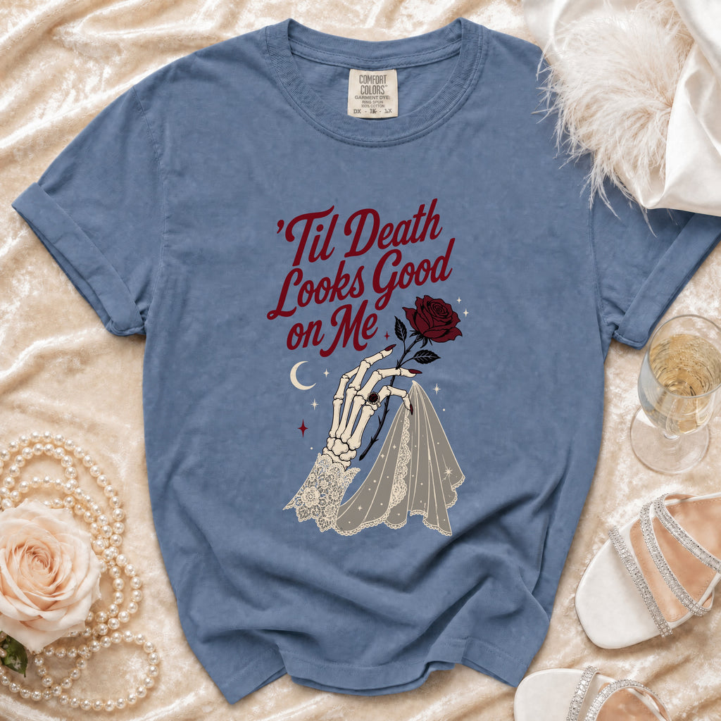 Blue t-shirt with "'Til Death Looks Good on Me" text and skeleton hand graphic.