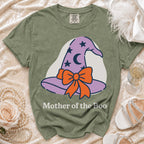 Green t-shirt with "Mother of the Boo" text and a purple witch hat graphic.