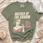 Green t-shirt with "Mother of the Groom Raised a Gentleman Ready for Champagne" text.