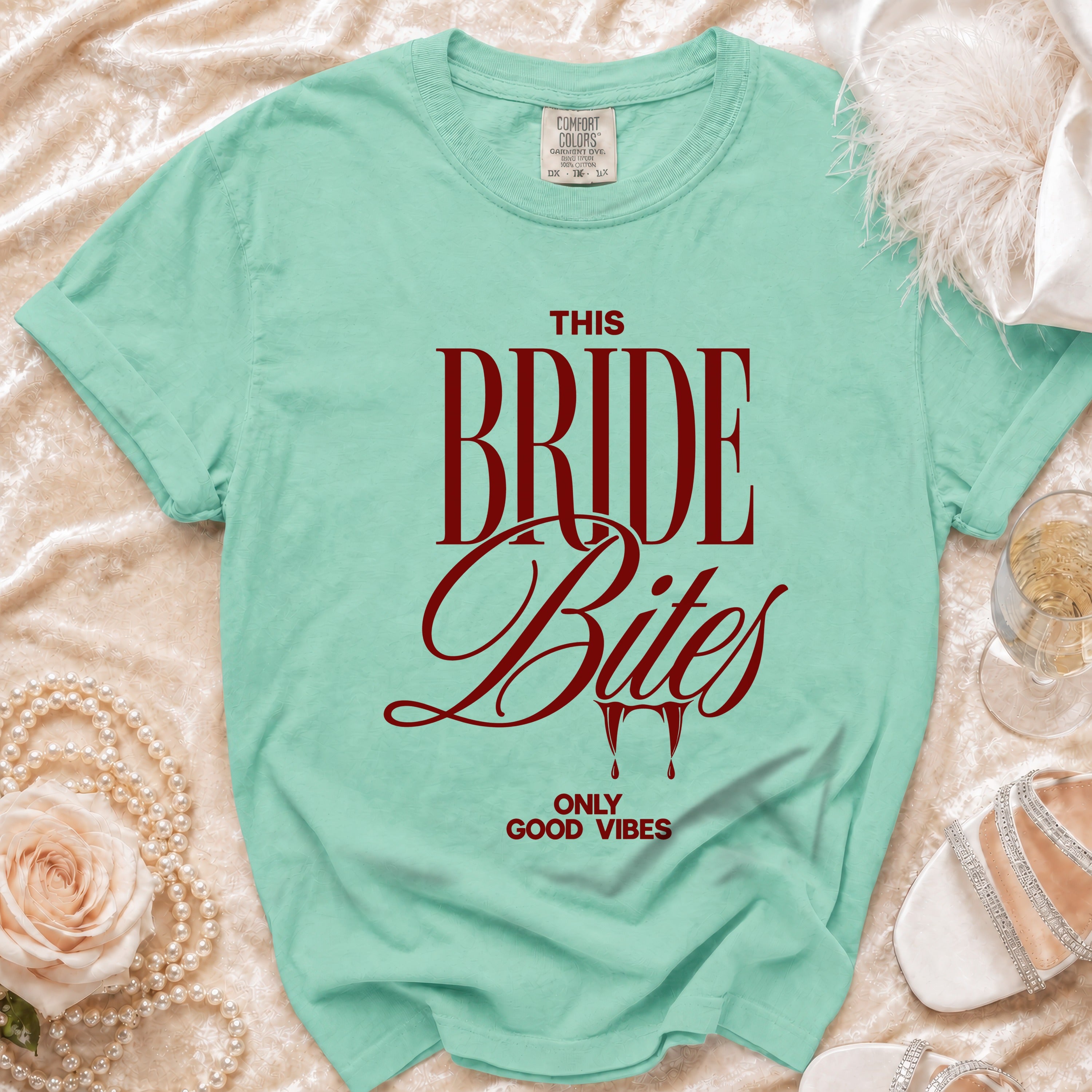 Mint t-shirt with red text "This Bride Bites Only Good Vibes".
