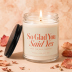 Lit candle with "So Glad You Said Yes" text, "Save the Date" and "Vowed 100% Soy Wax".