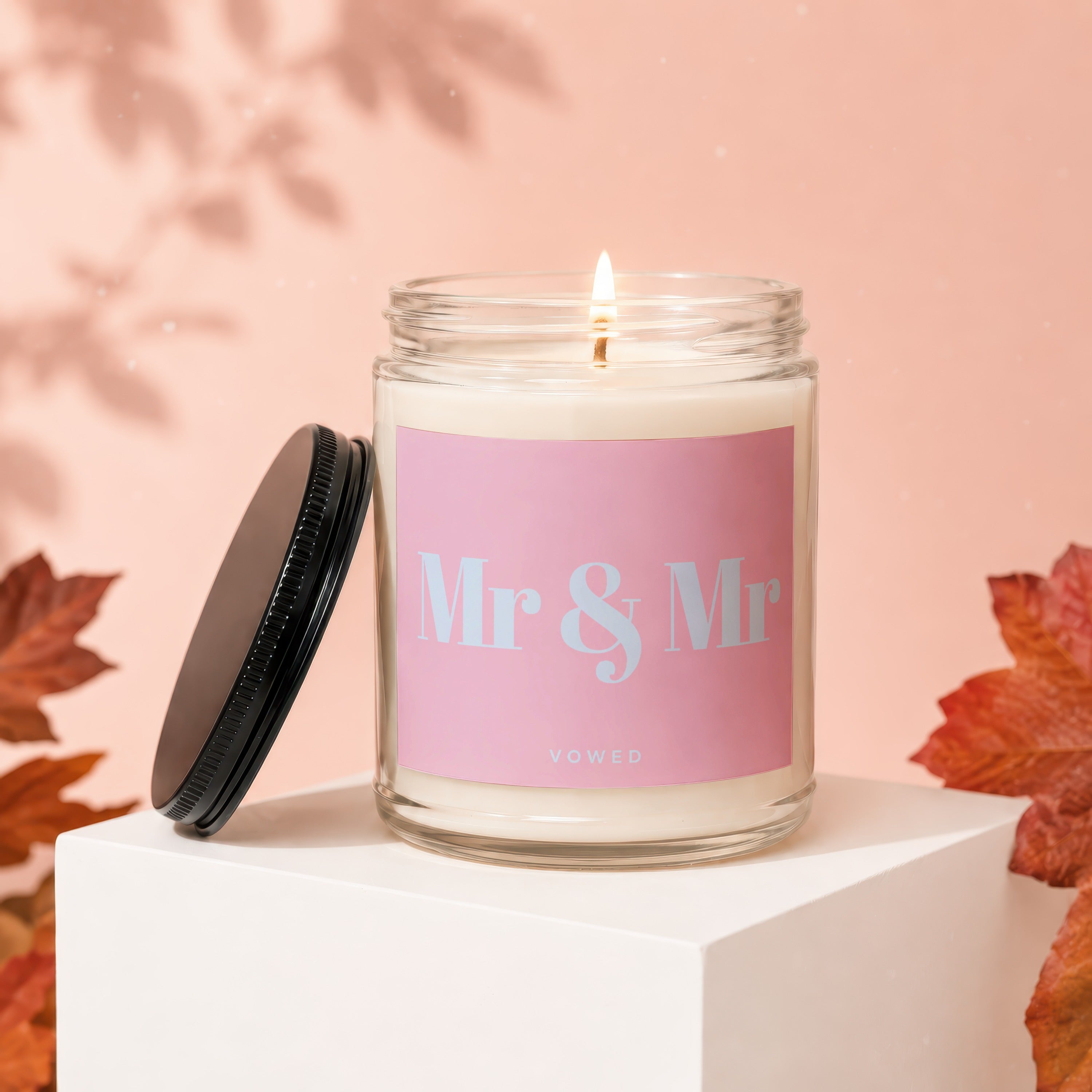 Candle with "Mr & Mr" and "vowed" text on a pink label.