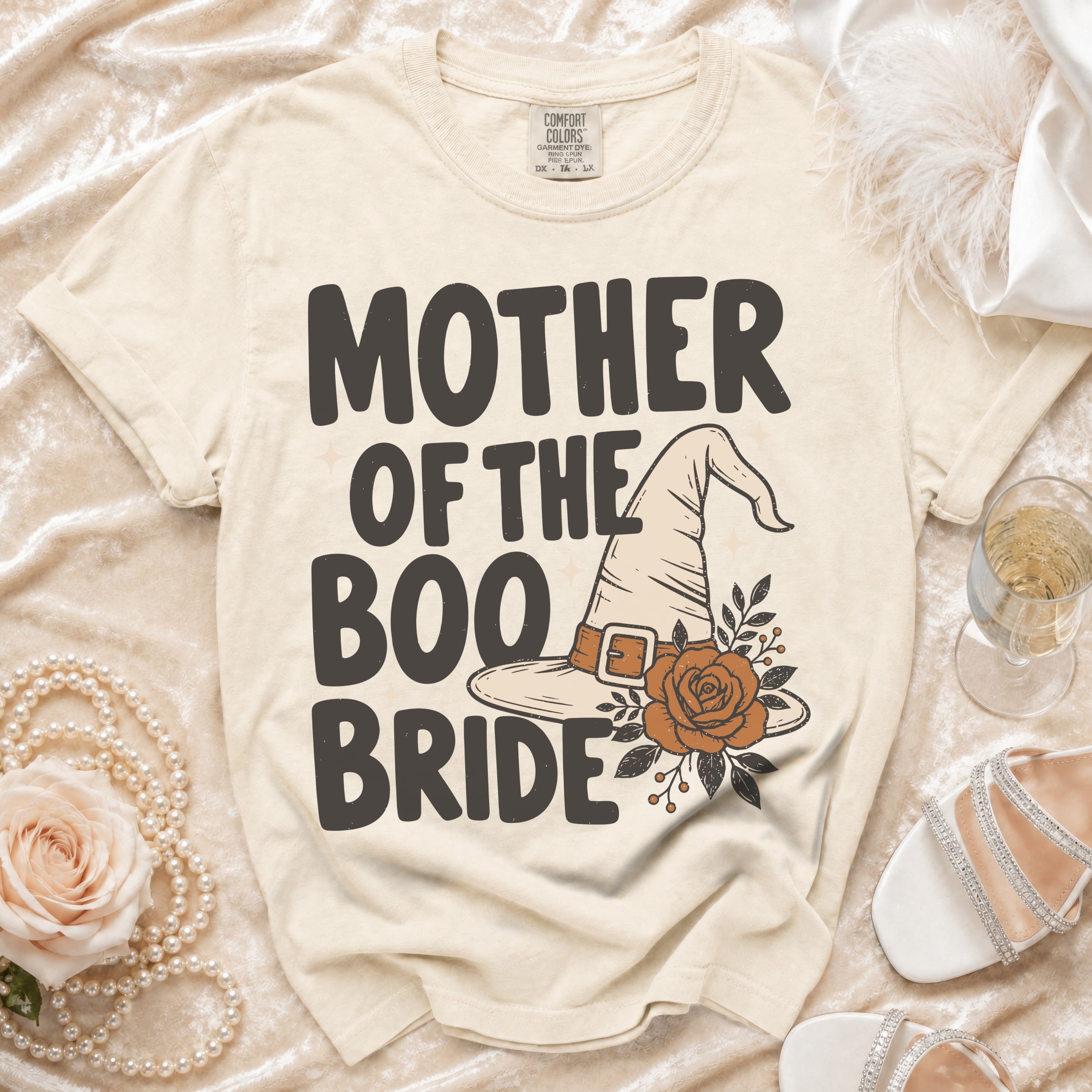 Cream t-shirt with "Mother of the Boo Bride" text and witch hat graphic.