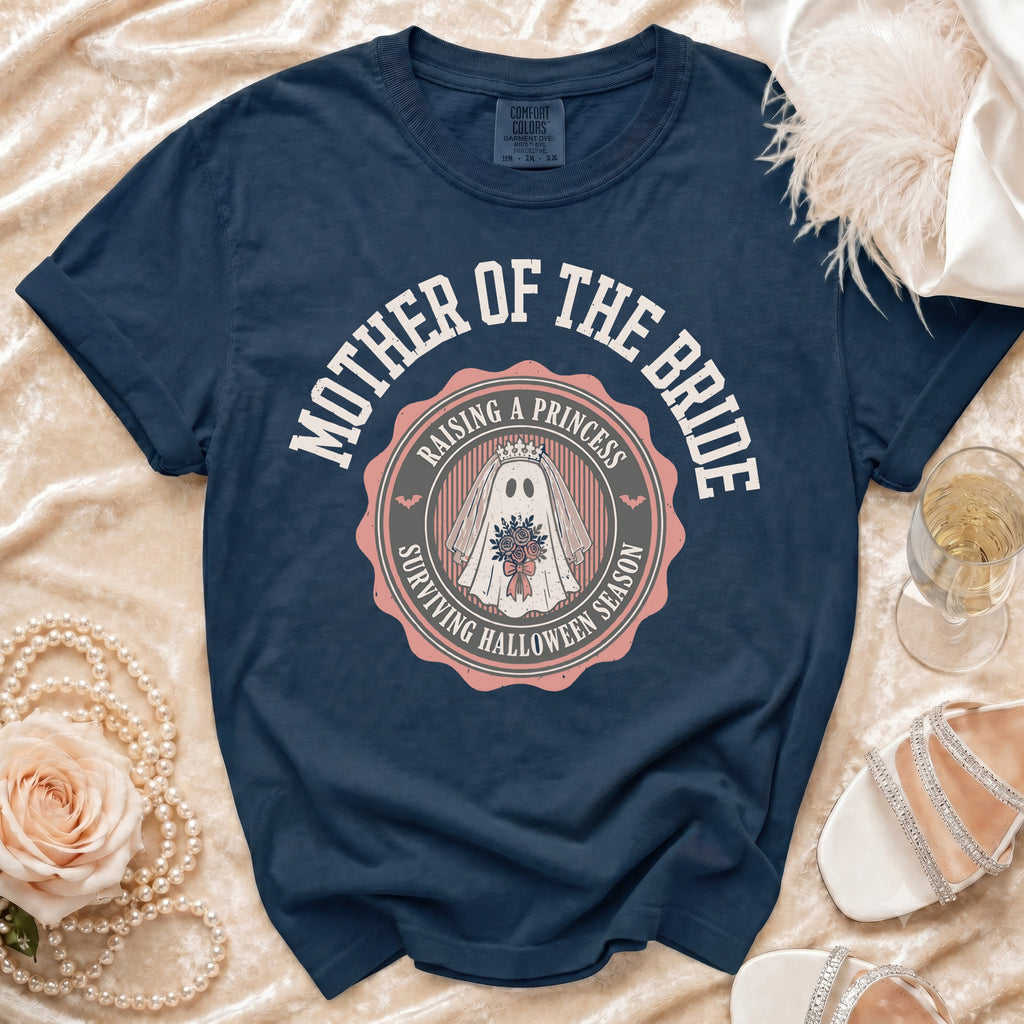 Navy t-shirt with "Mother of the Bride Raising a Princess Surviving Halloween Season" graphic.