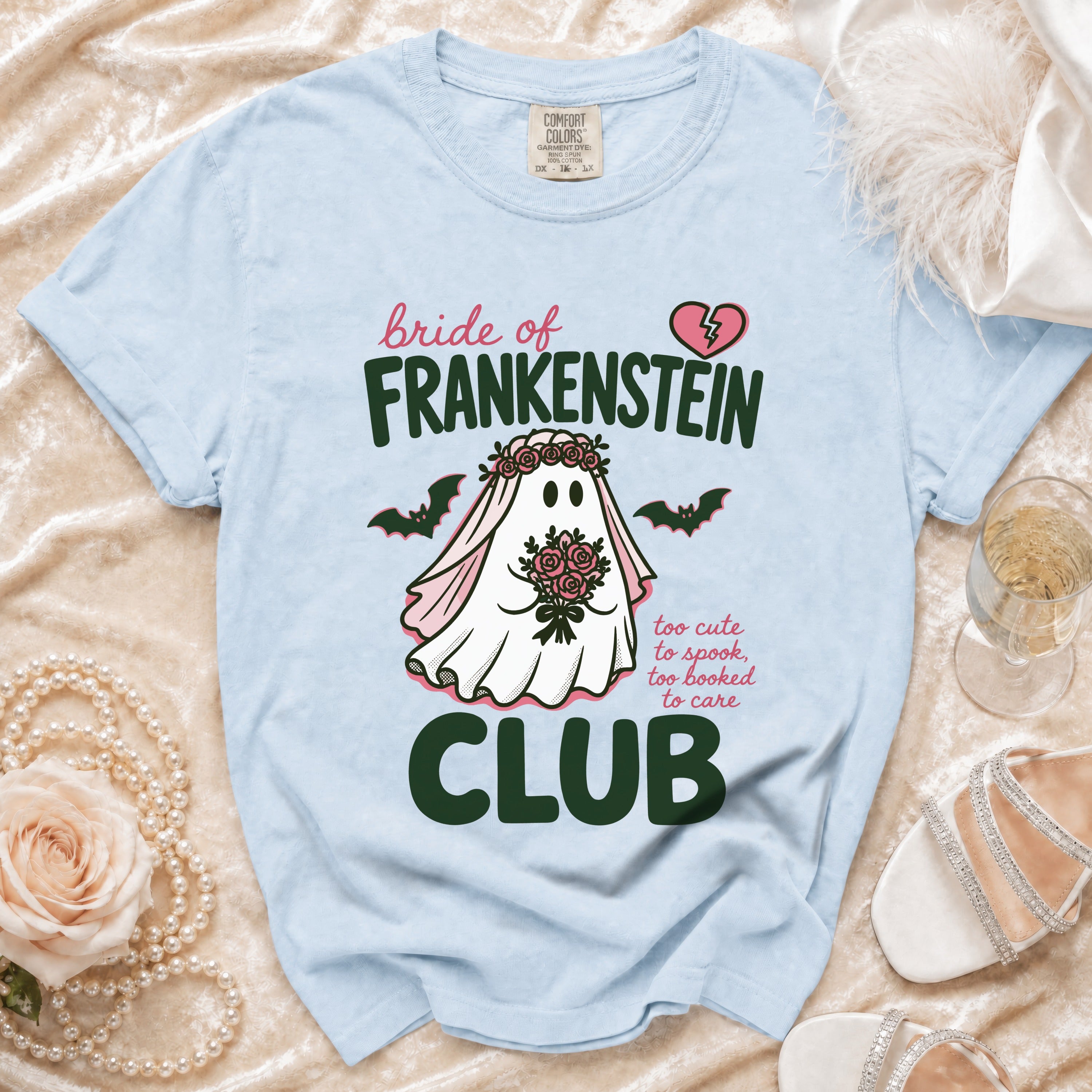 Light blue t-shirt with Bride of Frankenstein ghost graphic and text.