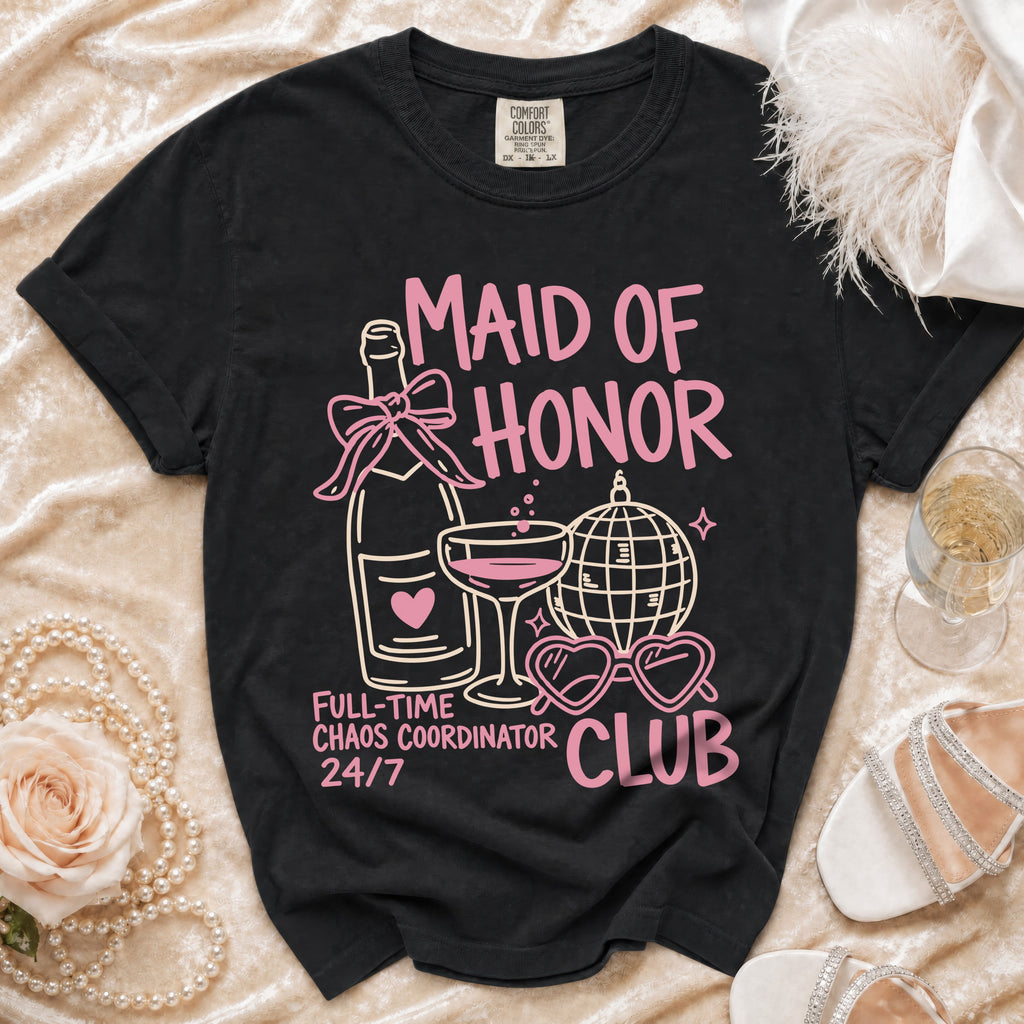 Black t-shirt with pink "Maid of Honor Club" graphic and champagne bottle.