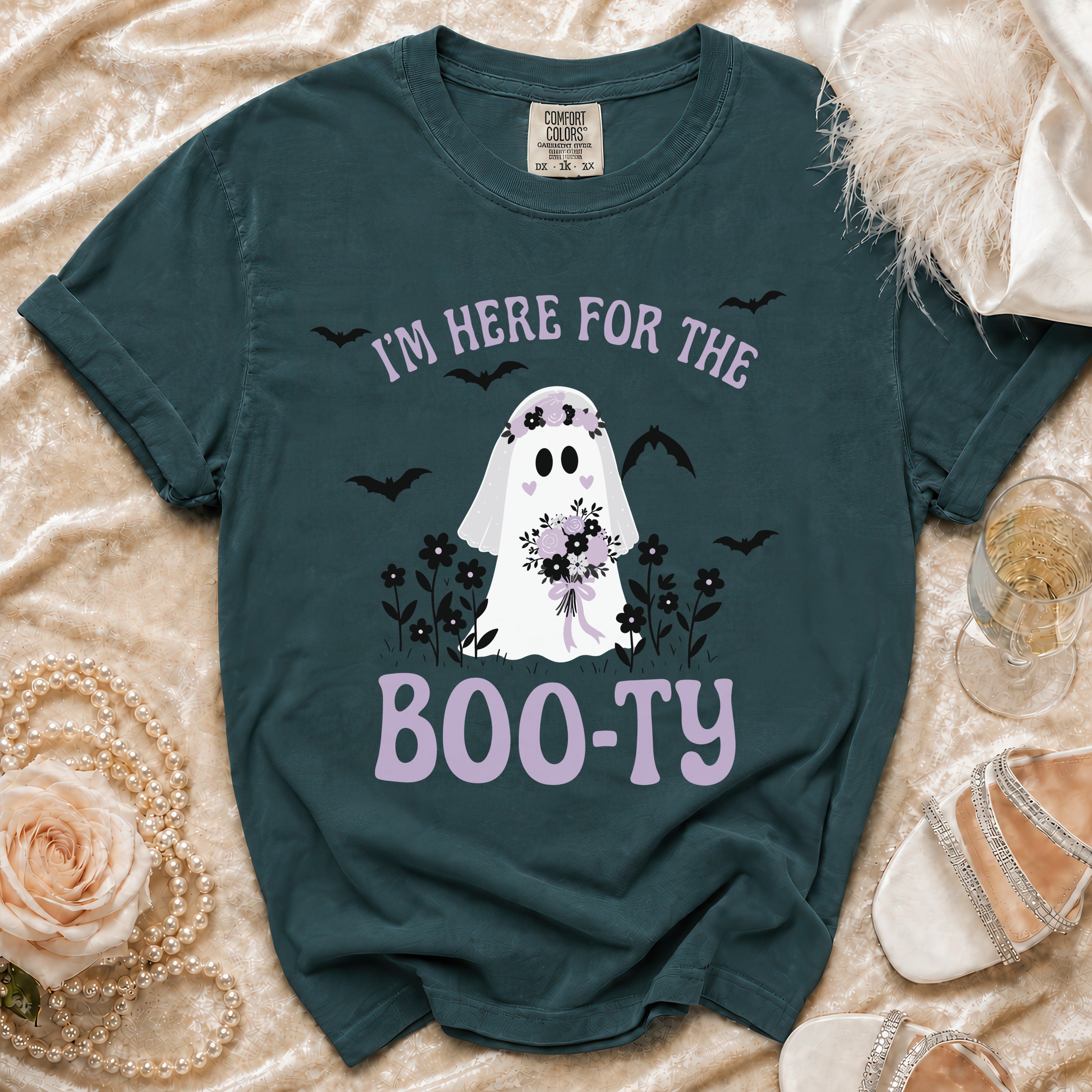 Dark teal t-shirt with ghost graphic saying "I'm here for the boo-ty".