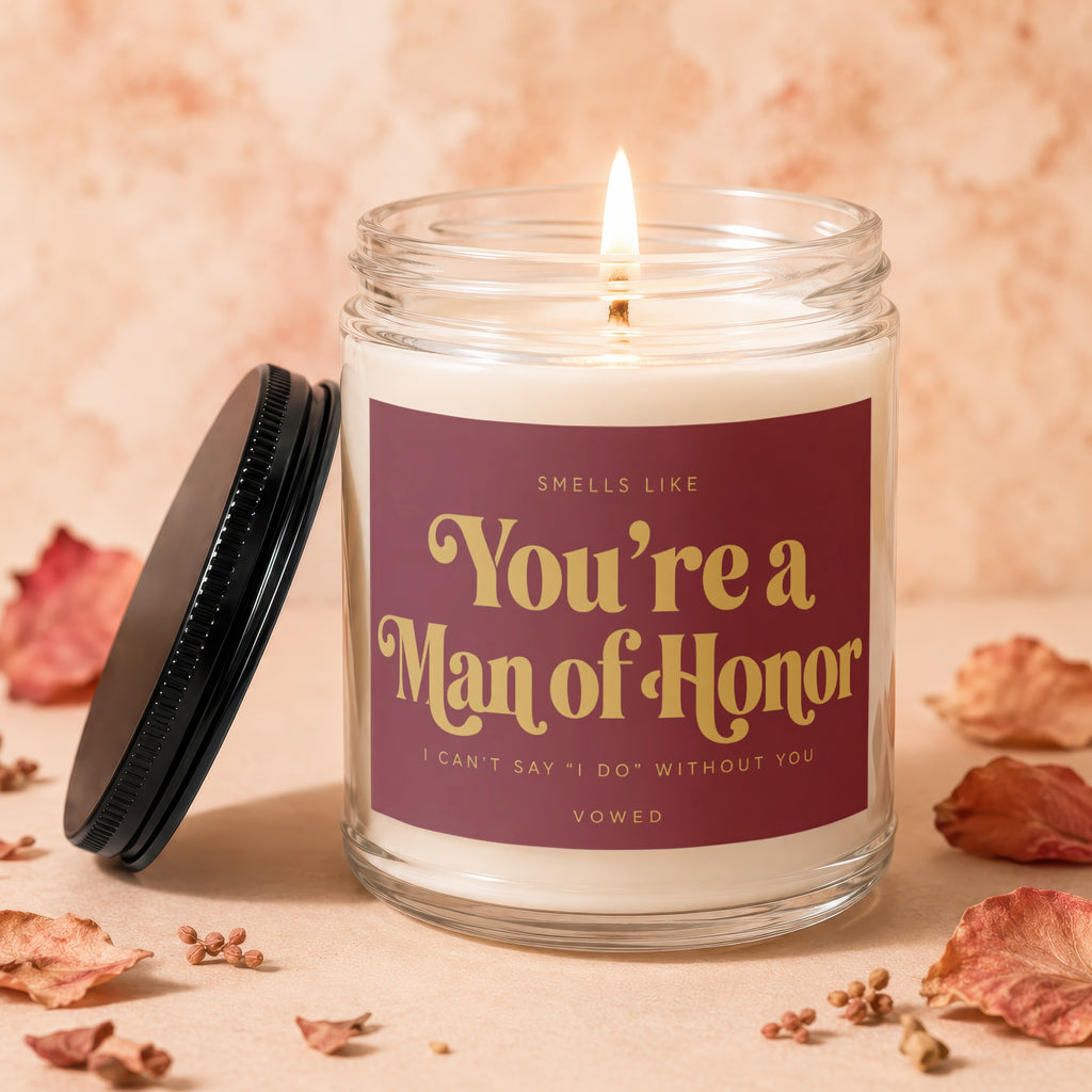 Candle with "You're a Man of Honor" text and a lit wick.