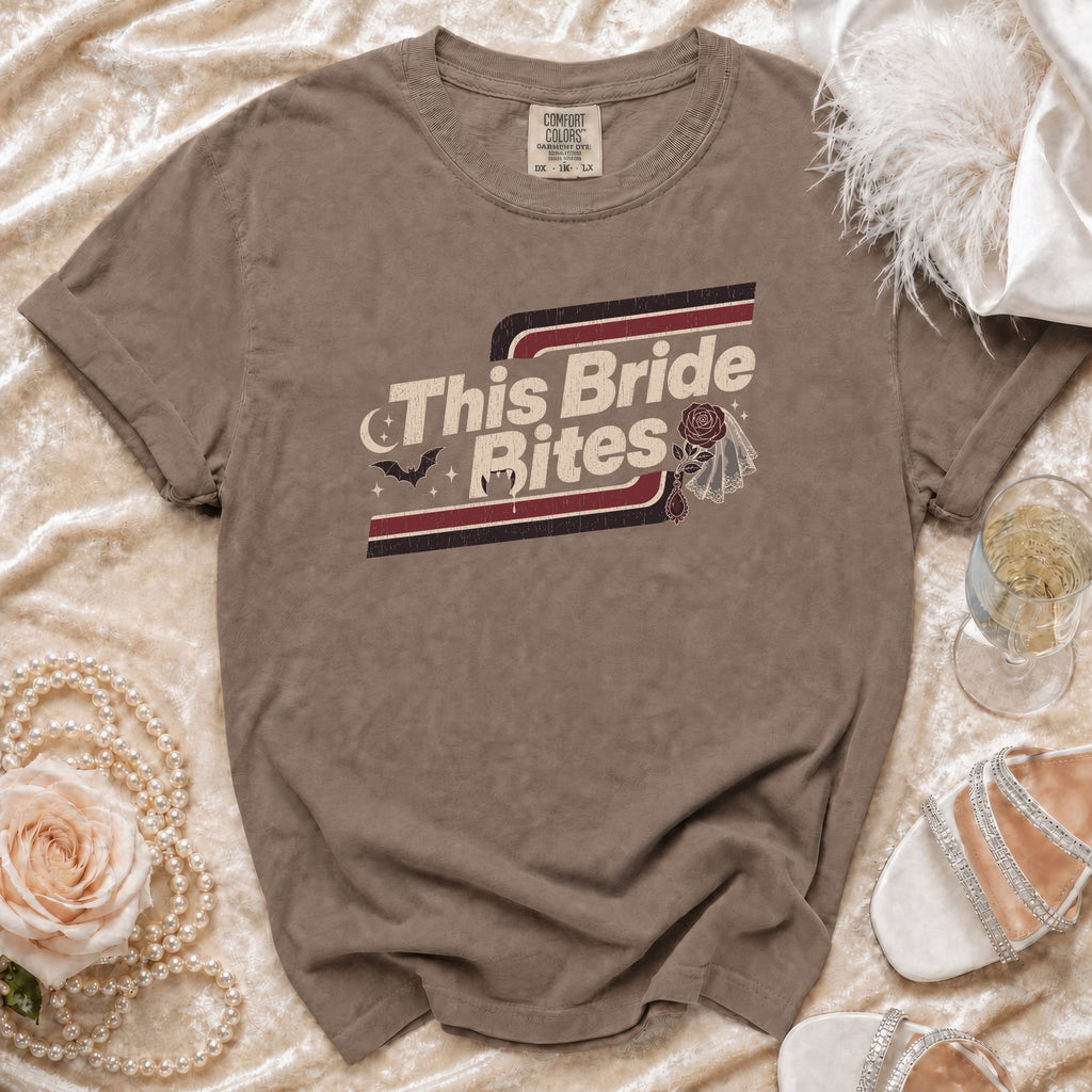 Brown t-shirt with "This Bride Bites" text and vampire graphics.
