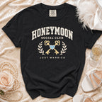 Black t-shirt with "Honeymoon Social Club" and "Just Married" text, two keys, and a heart.