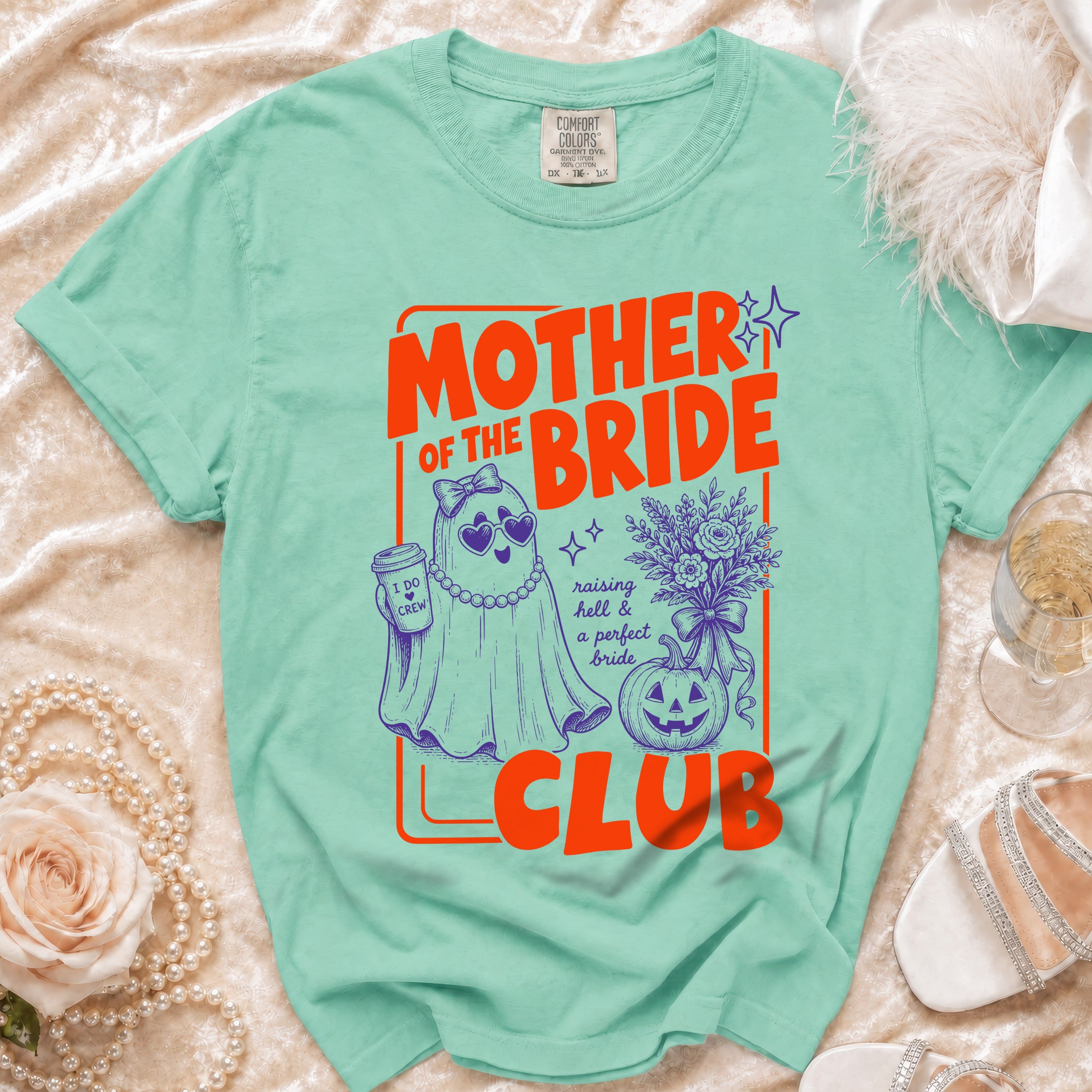 Mint green shirt with "Mother of the Bride Club" and ghost graphic.