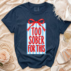 Navy t-shirt with gift box graphic and text "TOO SOBER FOR THIS".