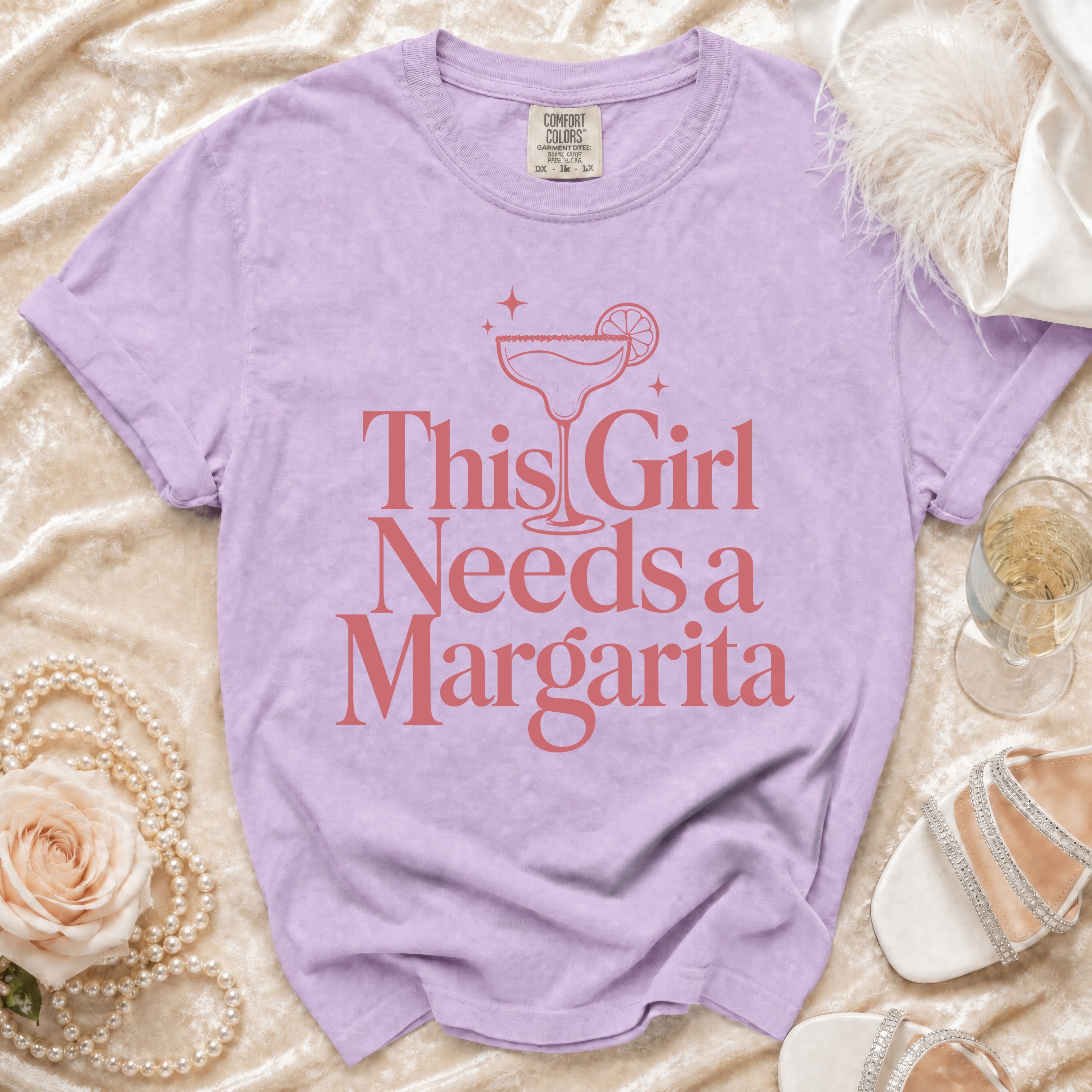 Purple Comfort Colors t-shirt with "This Girl Needs a Margarita" text.