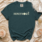 Teal t-shirt with "HONEYMOON" text and moon, bat graphics.