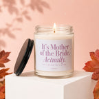 Lit candle with text "It's Mother of the Bride, Actually. VOWED."