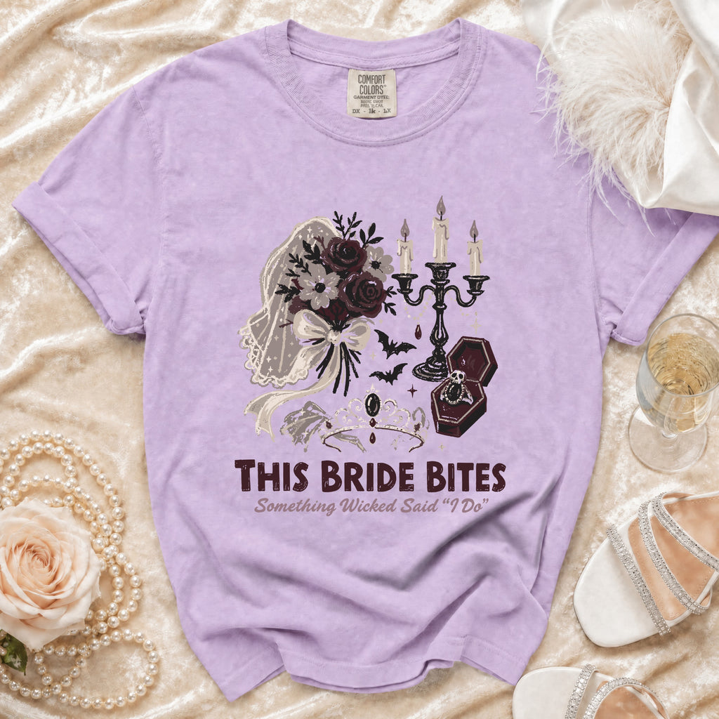Purple t-shirt with spooky wedding graphic and text "THIS BRIDE BITES".